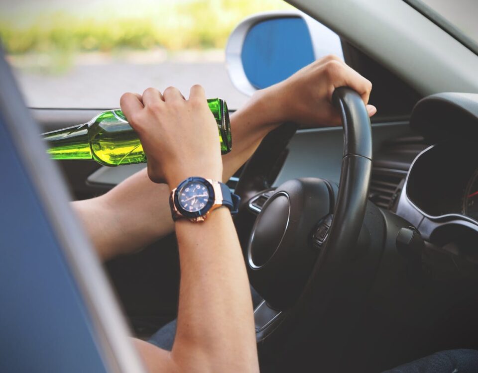 Person Driving and Drinking