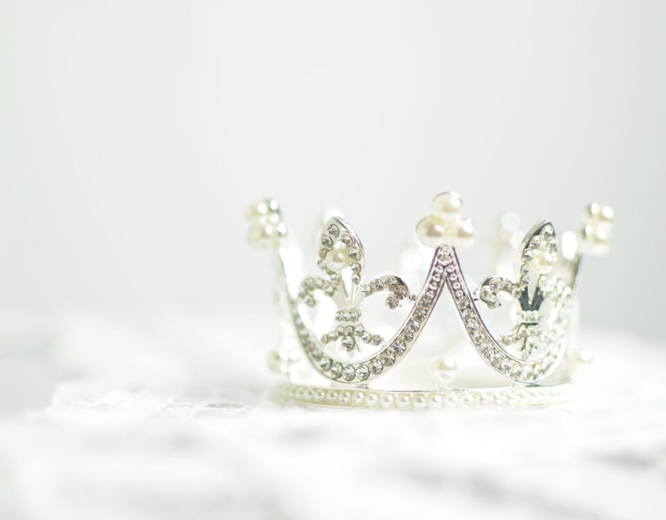shallow photography of silver-colored crown